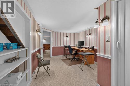Carpeted flooring throughout, accented by wall-mounted lighting fixtures - 799 Highway 6, Caledonia, ON 