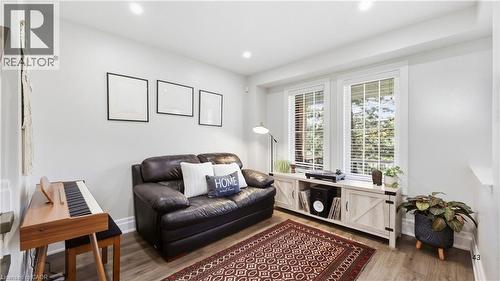 Recessed lighting, wood-finish flooring, and white walls create a bright interior - 2409 Postmaster Drive, Oakville, ON 