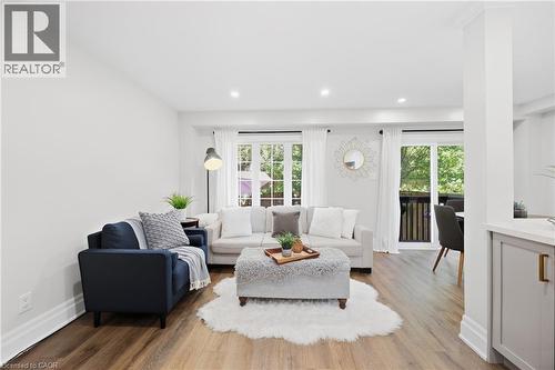 Wood-finish flooring, recessed lighting, and white crown molding - 2409 Postmaster Drive, Oakville, ON 