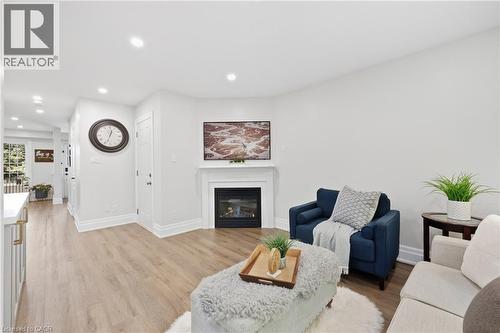 Recessed lighting illuminating wood-finish flooring - 2409 Postmaster Drive, Oakville, ON 