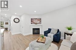 Recessed lighting illuminating wood-finish flooring - 