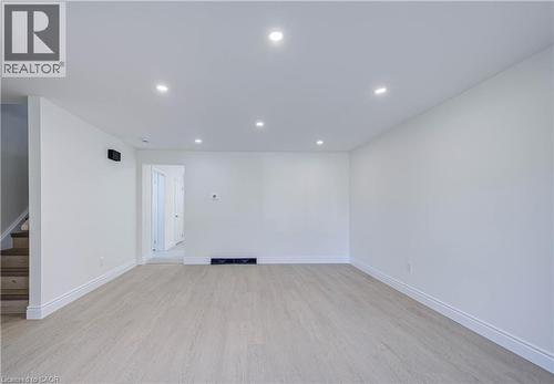 Recessed lighting, light wood-finish flooring, white walls, and bright white trim - 210 Ferguson Avenue, Cambridge, ON 