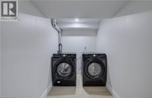 Dedicated laundry area featuring a built-in dryer vent, overhead lighting, and light-toned flooring - 210 Ferguson Avenue, Cambridge, ON 