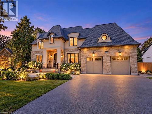Stone veneer facade with a prominent portico entrance - 236 Poplar Drive, Burlington, ON 
