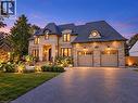 Stone veneer facade with a prominent portico entrance - 236 Poplar Drive, Burlington, ON 