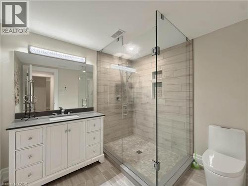 White vanity with double-door cabinetry, multiple drawers, and a light-toned countertop - 236 Poplar Drive, Burlington, ON 