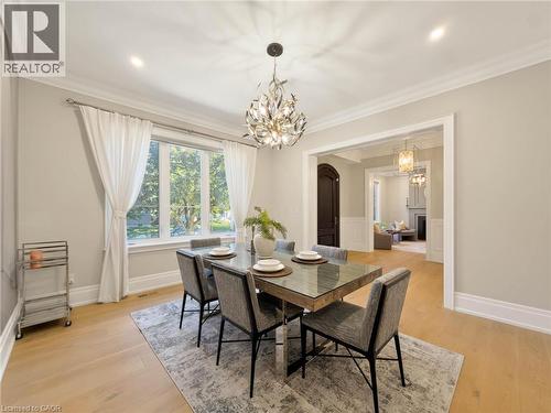 Hardwood-finish flooring, recessed lighting, and a decorative chandelier - 236 Poplar Drive, Burlington, ON 