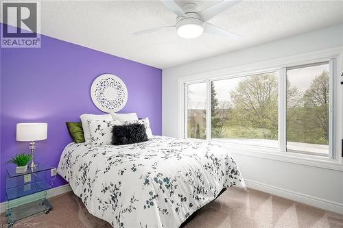 Wall-to-wall carpeting and a ceiling fan with integrated lighting - 4285 Couples Crescent, Burlington, ON 