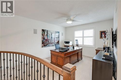 Carpeted room with a ceiling fan, a window with horizontal blinds, and built-in wall speakers - 4285 Couples Crescent, Burlington, ON 
