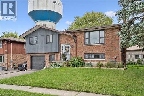 Brick and siding exterior with mature landscaping - 8 Christian Street, Baden, ON 
