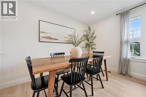 Recessed ceiling lighting, light-toned wood-finish flooring, white walls, and a large window - 8 Christian Street, Baden, ON 