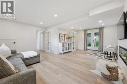 Light wood-finish flooring with recessed lighting - 