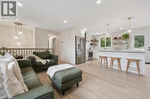 Recessed lighting, wood-finish flooring, white kitchen cabinetry, stainless steel appliances, and pendant lighting - 8 Christian Street, Baden, ON 