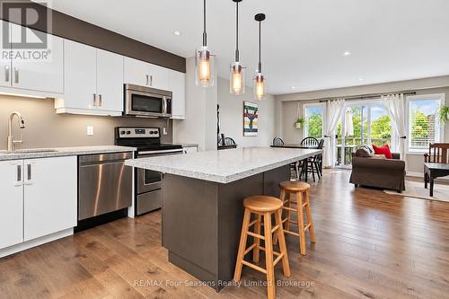 Kitchen with stainless appliances - 55 Conservation Way, Collingwood, ON 