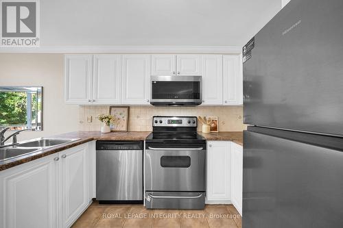 Kitchen with stainless steel appliances - 170 Flamborough Way, Ottawa, ON 
