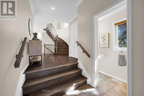 Bright foyer with curved wood staircase - 170 Flamborough Way, Ottawa, ON 