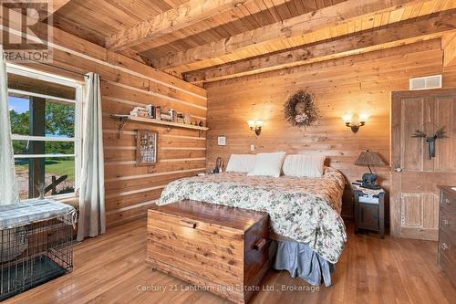 Primary bedroom on main level - 939 Kelly Road, Prince Edward County (Athol Ward), ON 