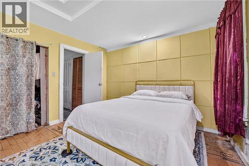 Recessed lighting, crown molding, paneled wall accent, and a white interior door - 199 N Locke Street N, Hamilton, ON 