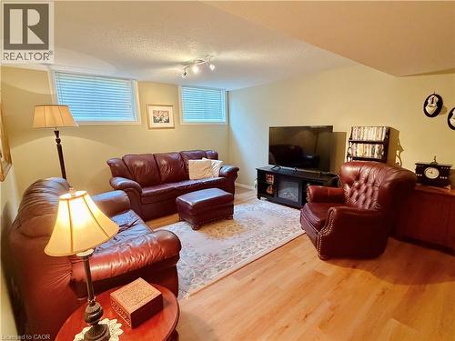 Wood-finish flooring with recessed lighting and two egress windows - 40 Stornoway Crescent, Huron East, ON 