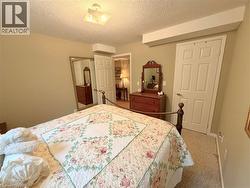 Wall-to-wall carpeting and a ceiling-mounted light fixture - 