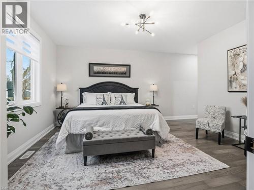 Bedroom with baseboards and dark wood-type flooring - 230 Knoll Street, Port Colborne, ON 