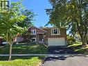 Brick exterior with a prominent bay window and white trim - 410 Lakeview Drive, Waterloo, ON 
