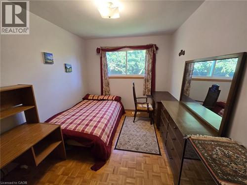 Parquet wood flooring, a window with natural light, and an overhead light fixture - 410 Lakeview Drive, Waterloo, ON 