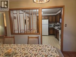 Wood-finish room divider with decorative screens - 