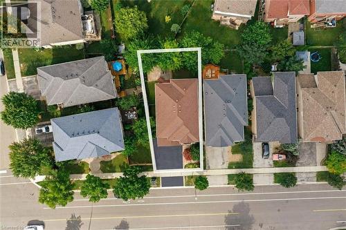 Aerial view of property featuring a multi-pitched roofline, asphalt driveway, and backyard space with mature trees - 2381 Grand Oak Trail, Oakville, ON 