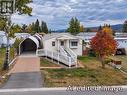 AI edited image to remove tarp from ramp access, ramp slightly different than actual. - 11 Topaz Crescent, Logan Lake, BC 