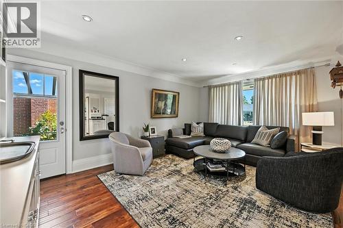 Hardwood-finish flooring, recessed lighting, and a window with extensive drapery - 2209 Ghent Avenue, Burlington, ON 