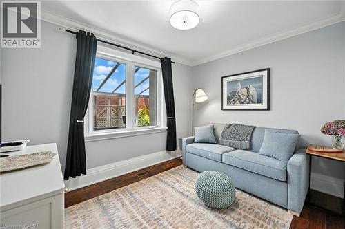 Hardwood flooring, crown molding, white trim, recessed lighting, and a double window - 2209 Ghent Avenue, Burlington, ON 