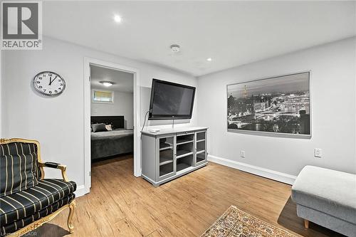 Wood-finish flooring with white baseboards, recessed ceiling lighting, and a neutral wall color - 2209 Ghent Avenue, Burlington, ON 