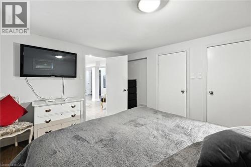 White walls, recessed lighting, and wood-finish flooring - 2209 Ghent Avenue, Burlington, ON 