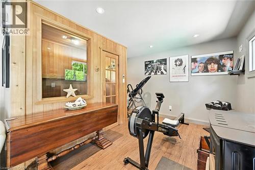 Wood-finish flooring, recessed lighting, and a wood-paneled wall with an interior window - 2209 Ghent Avenue, Burlington, ON 