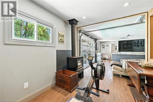 Wood-finish flooring, recessed lighting, and a window with exterior tree coverage - 2209 Ghent Avenue, Burlington, ON 
