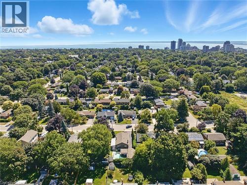 Aerial perspective showcasing residential properties within a tree-lined neighborhood - 2209 Ghent Avenue, Burlington, ON 
