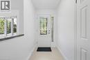 Entryway featuring a decorative glass door, coordinating sidelight, and tile flooring - 49 Beverly Crescent, Welland, ON 