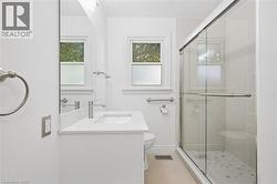White vanity with an integrated sink, polished chrome faucet, and quartz countertop - 