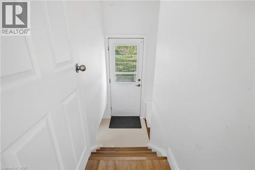 White paneled door with a round knob - 49 Beverly Crescent, Welland, ON 