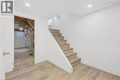 Wood-finish flooring, white painted walls, and recessed lighting - 49 Beverly Crescent, Welland, ON 