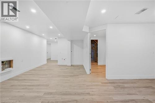 Recessed ceiling lighting, light wood-finish flooring, white painted walls, and white trim - 49 Beverly Crescent, Welland, ON 