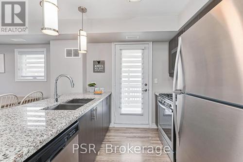 Kitchen & Door to Balcony with Gas Connection - 308 - 4 Anchorage Crescent, Collingwood, ON 
