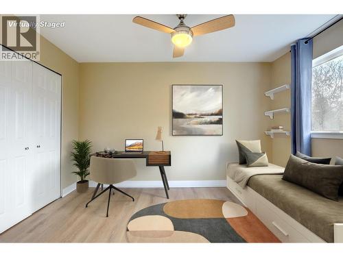 Virtually staged second bedroom. Could be an office or a den because of the french doors. - 505 Browne Road Unit# 103, Vernon, BC 
