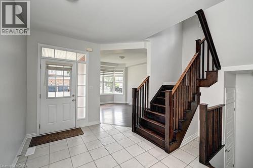 Entryway with white tile flooring - 236 Ridge Road, Cambridge, ON 