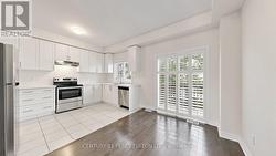 Main Floor Kitchen/Terrace Overlooking Backyard - 
