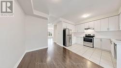 Main Floor Kitchen and Breakfast Area - 