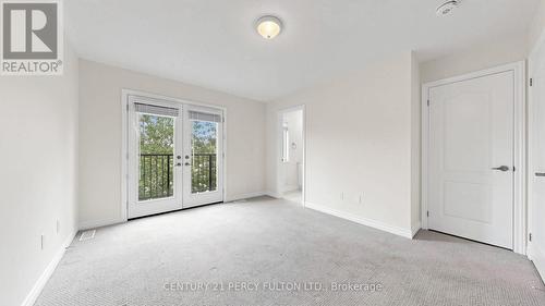 Upper Floor Primary Bedroom Leading to Balcony - 64 Ferris Square, Clarington, ON 
