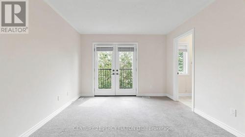 Primary Bedroom with Balcony Overlooking Backyard - 64 Ferris Square, Clarington, ON 