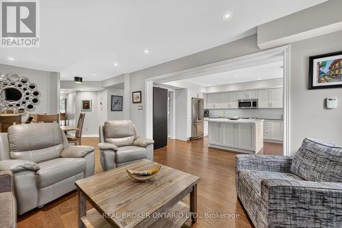 Family room open to kitchen and dining - 30 Masters Crescent, Georgian Bay, ON 